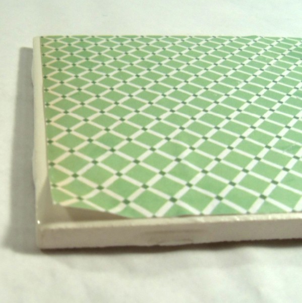 Paper lifting on tile coaster